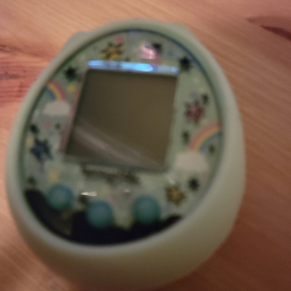 Tamagotchi magic in mint green with pusheen cover